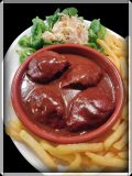 Varkenswangen met saus van blauwe Chimay en witloofsla met appel en walnoten